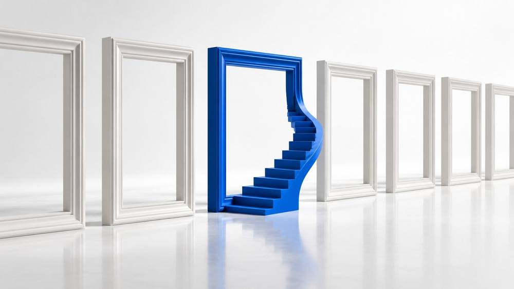 Blue picture frame with a staircase rising inside it, among white frames on a glossy white floor